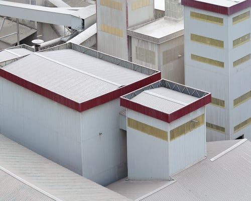 Commercial rooftops finished with a protective waterproof coating system